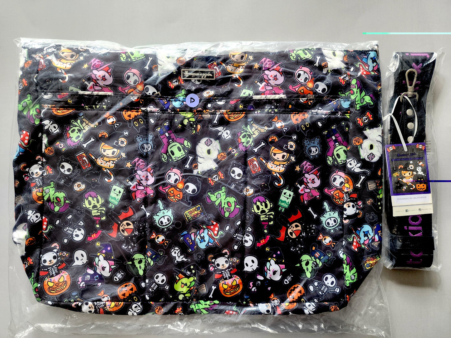 Halloween-themed bag with colorful designs on a gray background