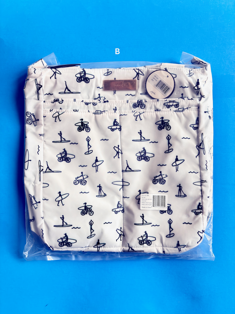 Packaged white shorts with black patterns on a blue background