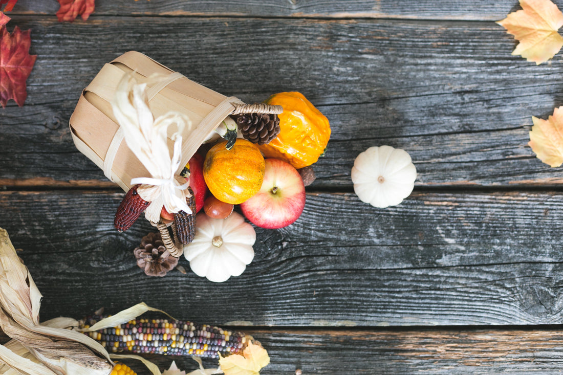 fall harvest with white pumpkins, apples, leaves 