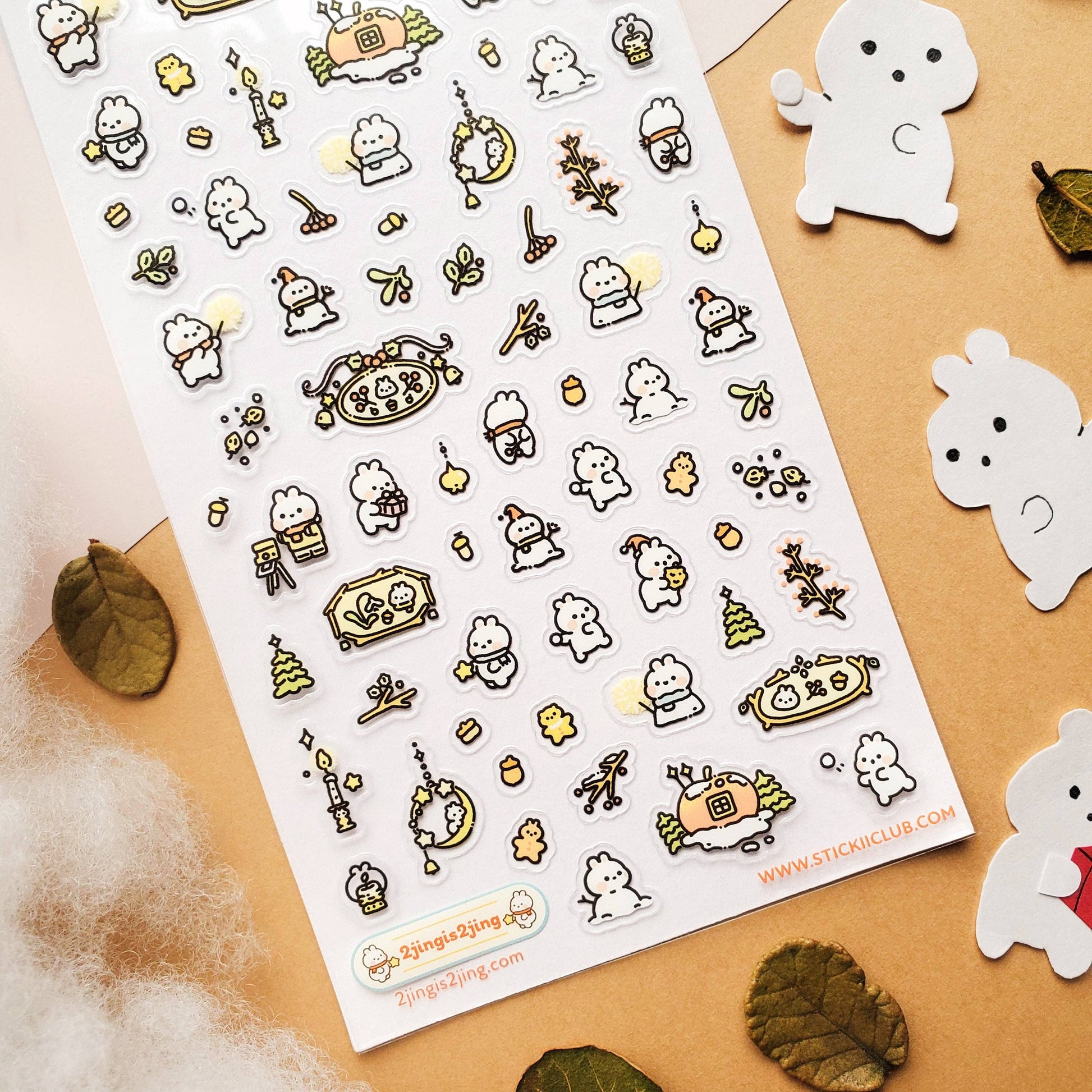 Sheet of cute character stickers with a decorative border on a beige background.