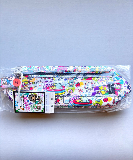 Colorful patterned belt with cartoon characters in clear packaging on a light gray background