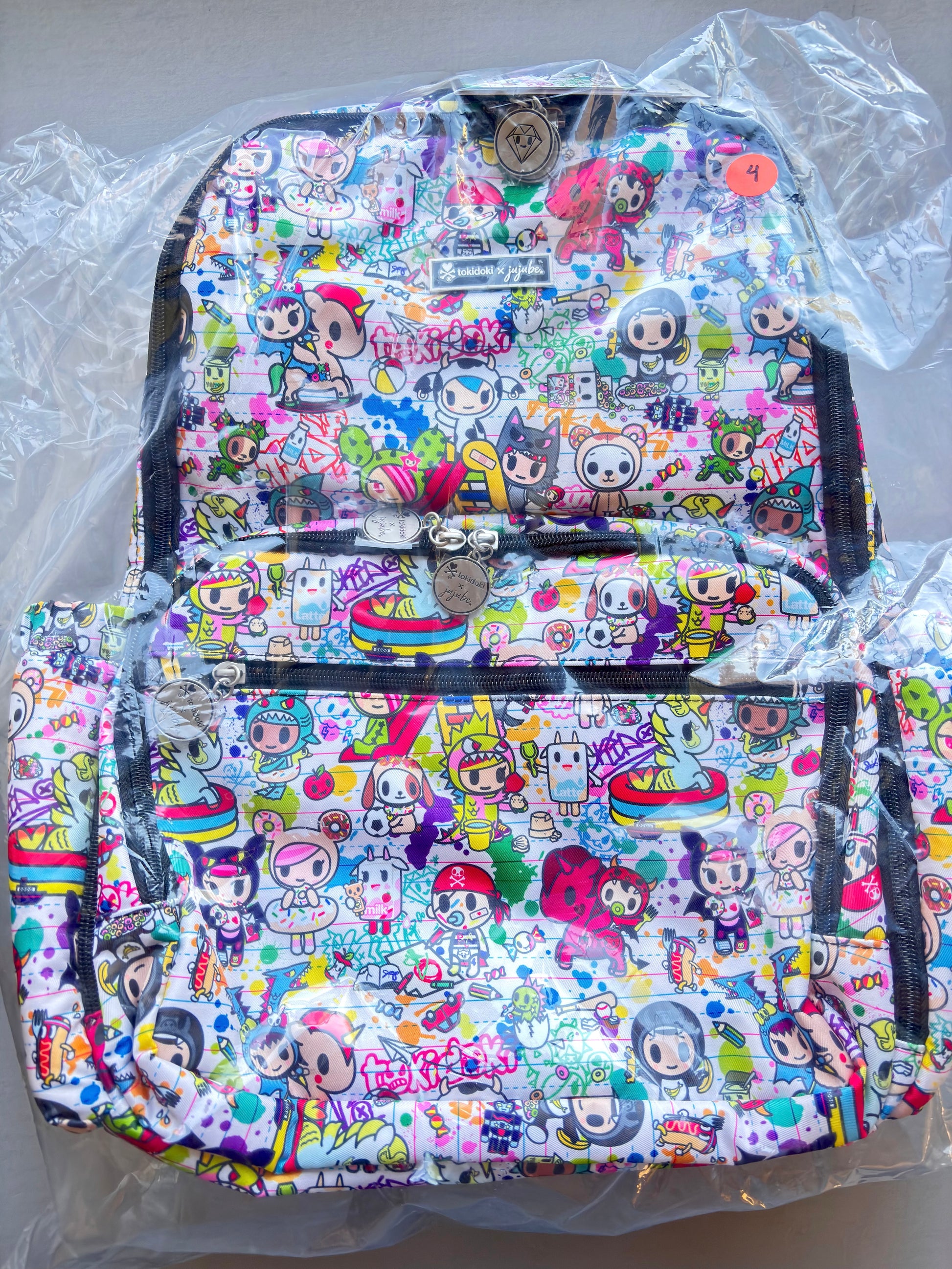 Colorful backpack with cartoon character design on a clear background