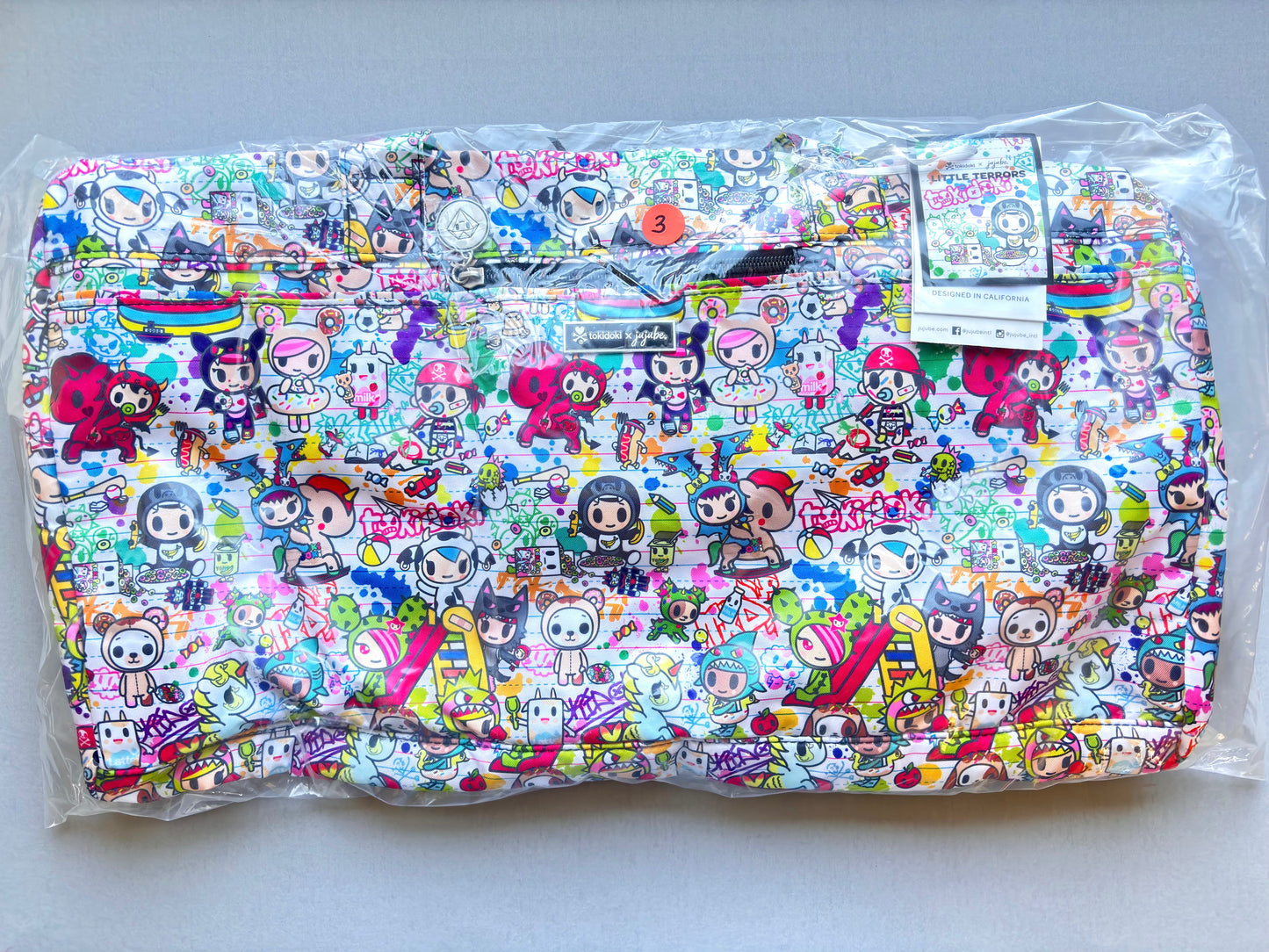 Colorful bag with cartoon character pattern on a white background