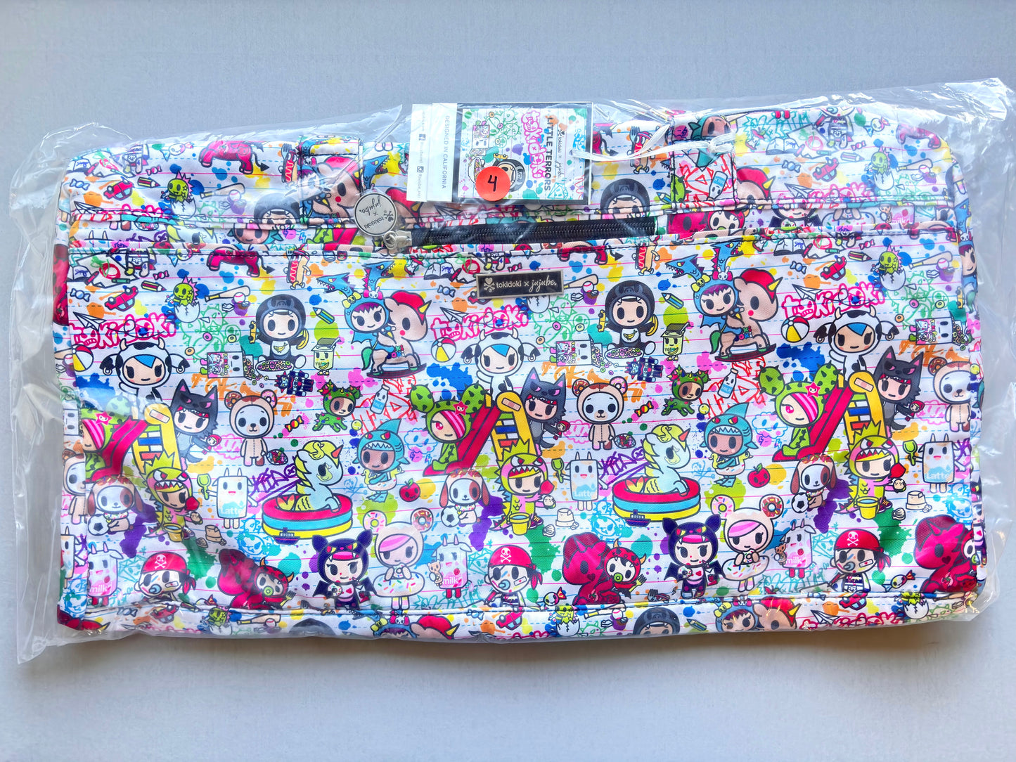 Colorful pouch with cartoon character pattern on a white background