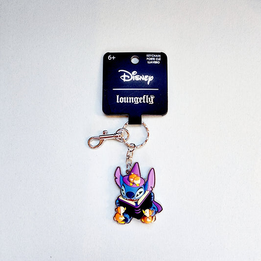 Keychain with Disney Halloween Stitch character reading a book to ducks on a white background