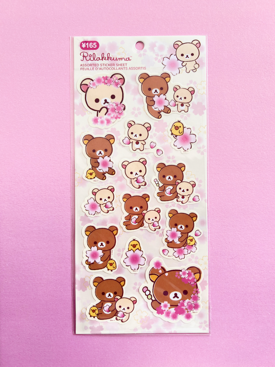 Sticker sheet with cartoon bears and flowers on a pink background
