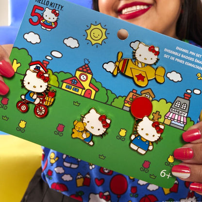 girl holding the 4 piece pin set