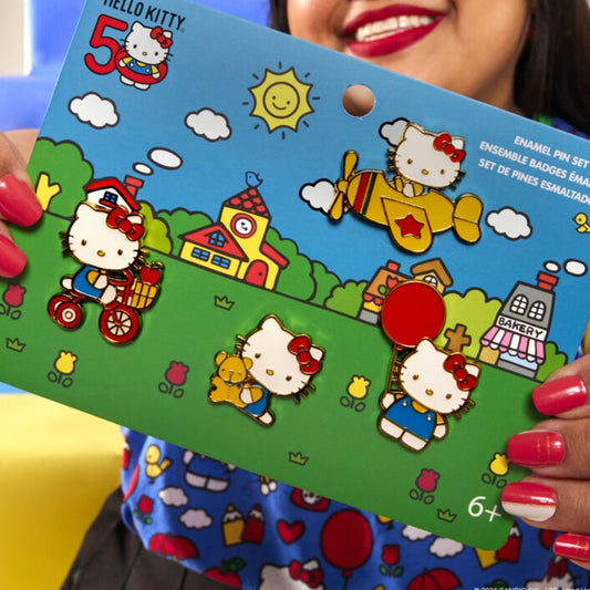 girl holding the 4 piece pin set