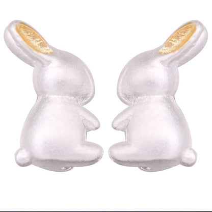 Silver bunny-shaped earrings on a white background