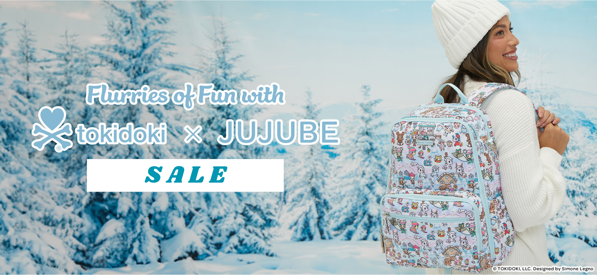 Person wearing a backpack with a winter scene design, standing in a snowy landscape. 'Flurries of Fun with tokidoki x JUJUBE' sale text is displayed.