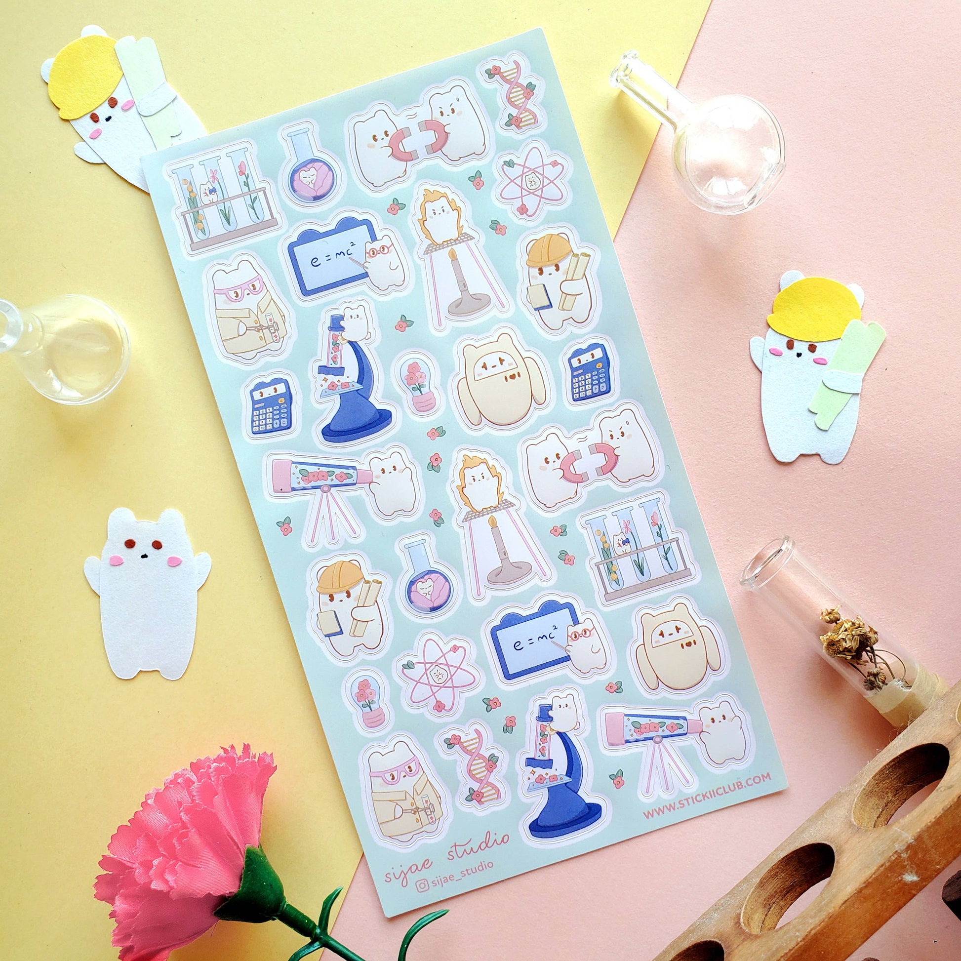 Sheet of cute cartoon science stickers on a colorful background with small decorative items.