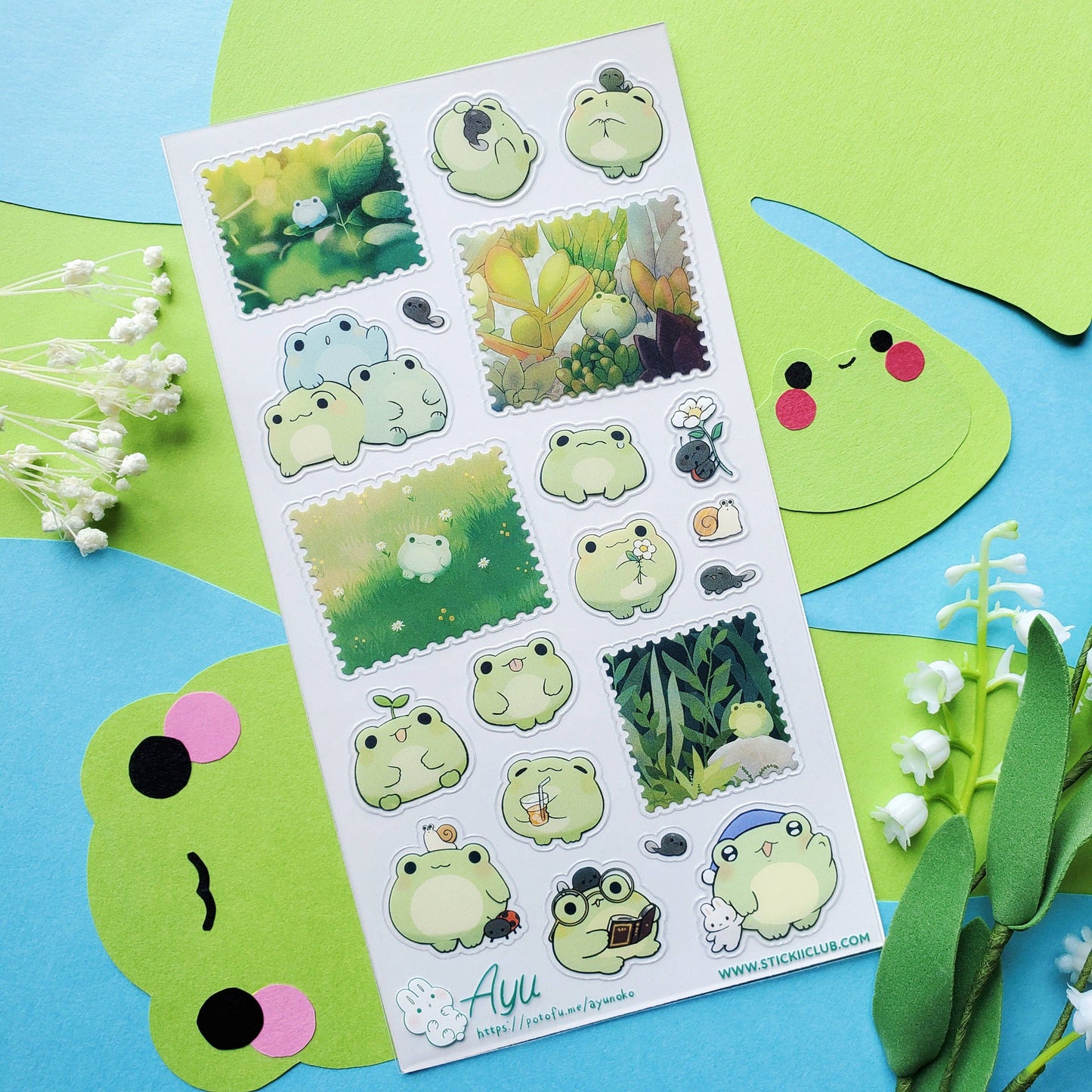 Sheet of frog-themed stickers on a colorful background with decorative elements.