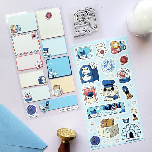 Collection of Arctic-themed stickers and stationery items on a light surface.