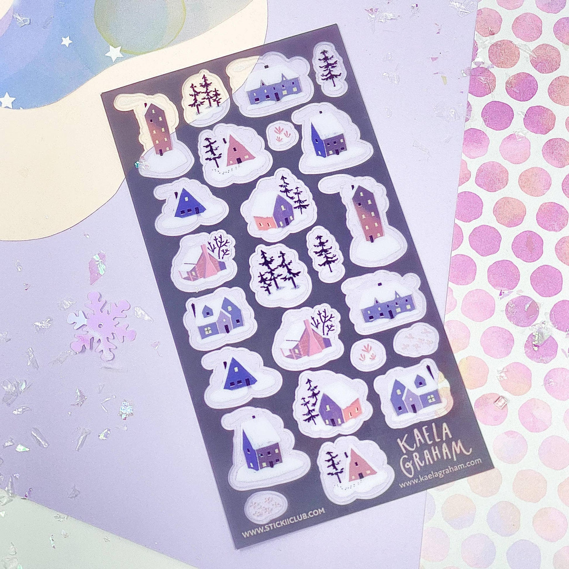 Sheet of decorative stickers with houses and snowflakes on a colorful background