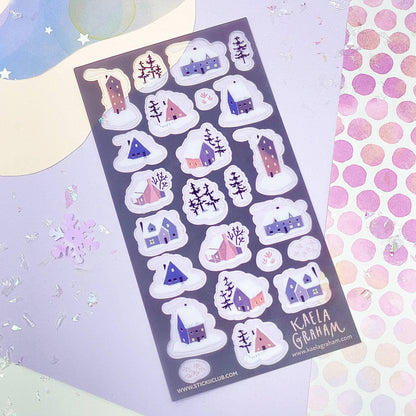 Sheet of decorative stickers with houses and snowflakes on a colorful background