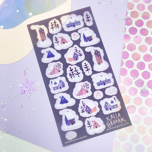 Sheet of decorative stickers with houses and snowflakes on a colorful background