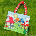 Loungefly The Smurfs Canvas Tote Bag on green grass background