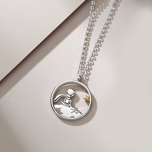 Silver necklace with a circular pendant on a beige background