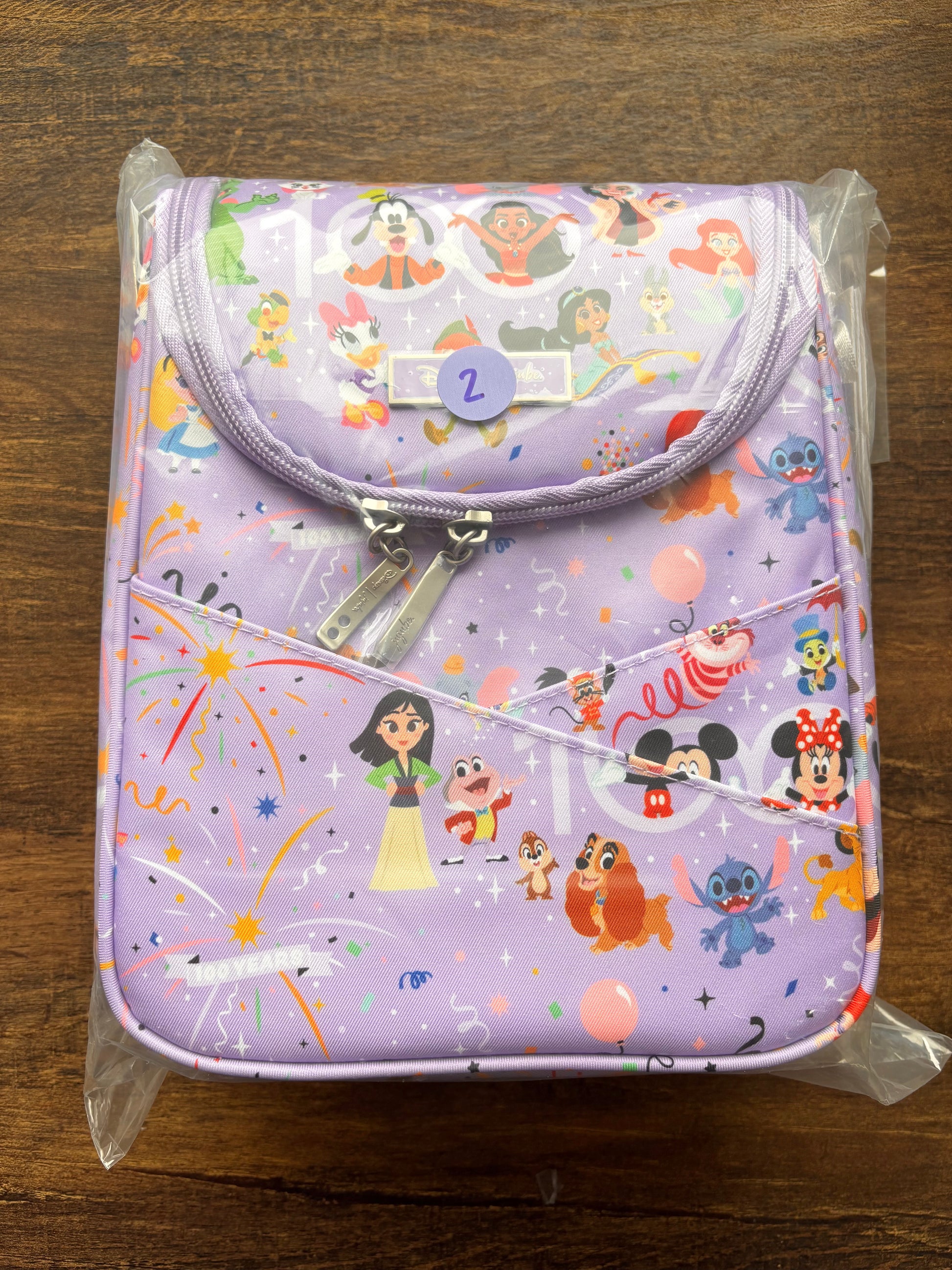 Disney cooler bag
 with character print on a wooden surface