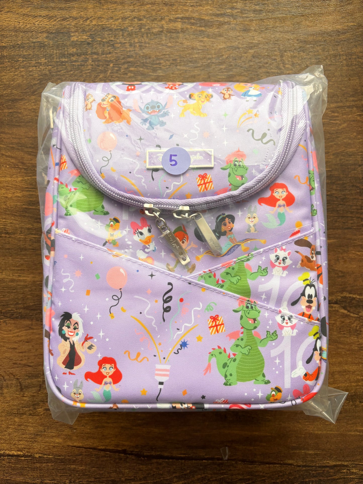 Disney insulated bottle bag with cartoon character pattern on a wooden surface