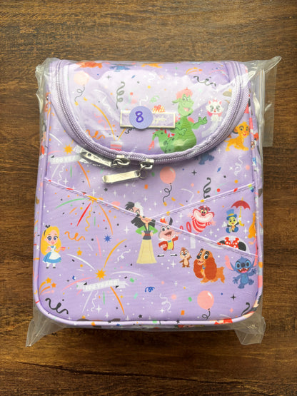DIsney lunch bag with cartoon characters on a wooden surface