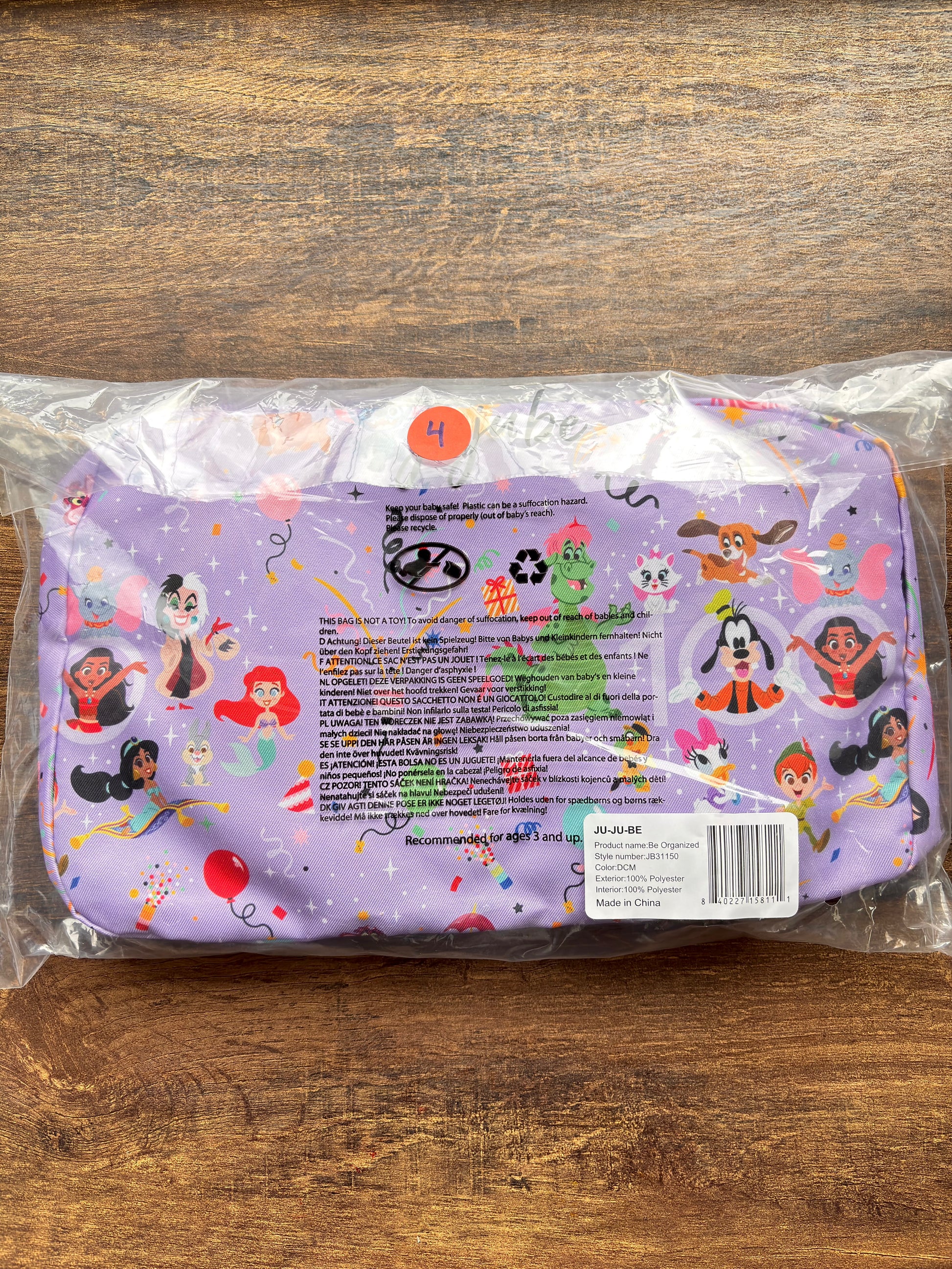 Organizing cubes with Disney cartoon characters on a wooden surface
