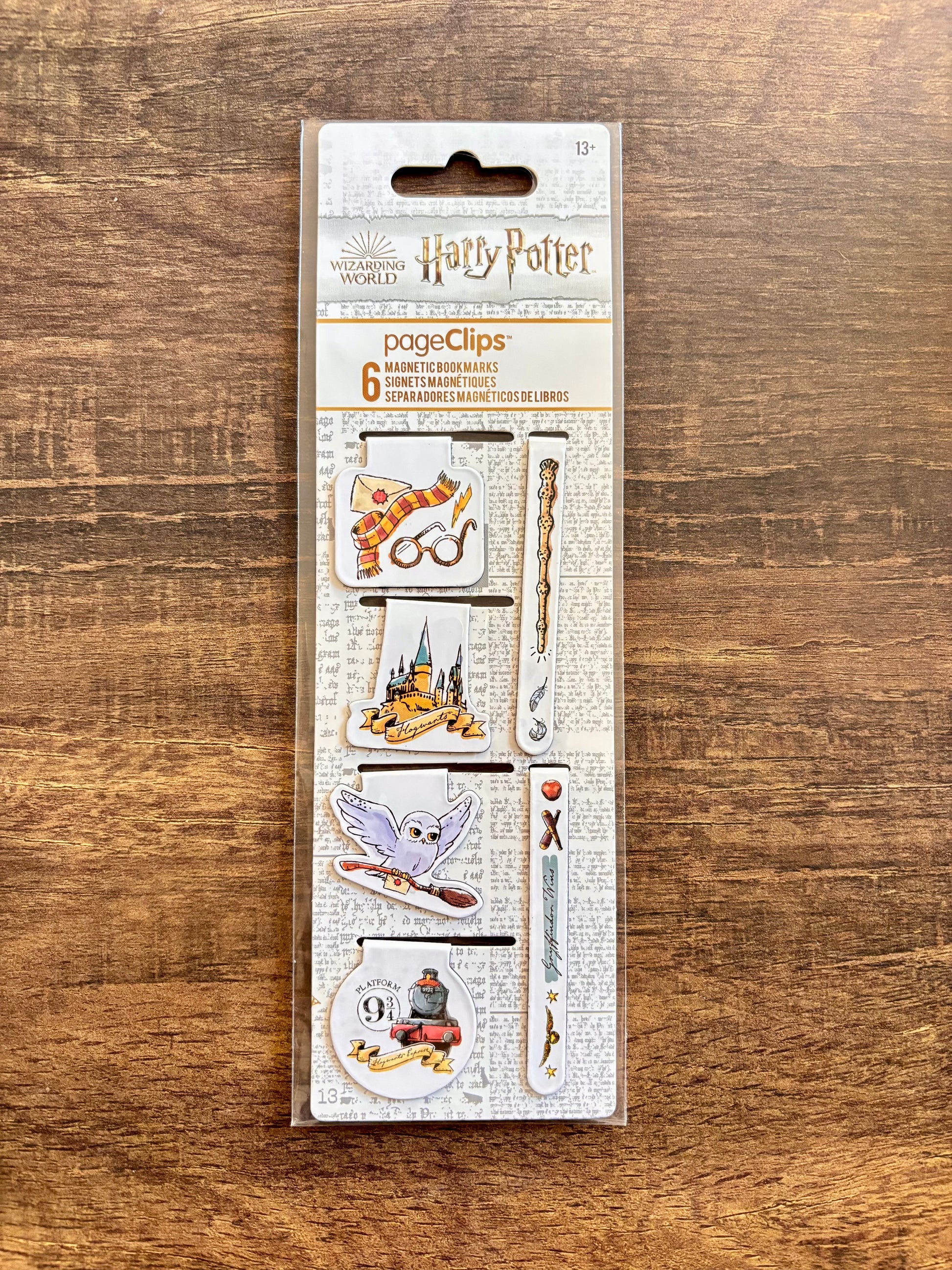 Pack of Harry Potter-themed page clips on a wooden surface