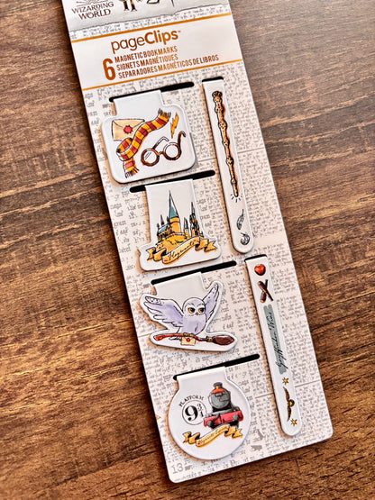 Set of magnetic bookmarks with Harry Potter design on a wooden surface