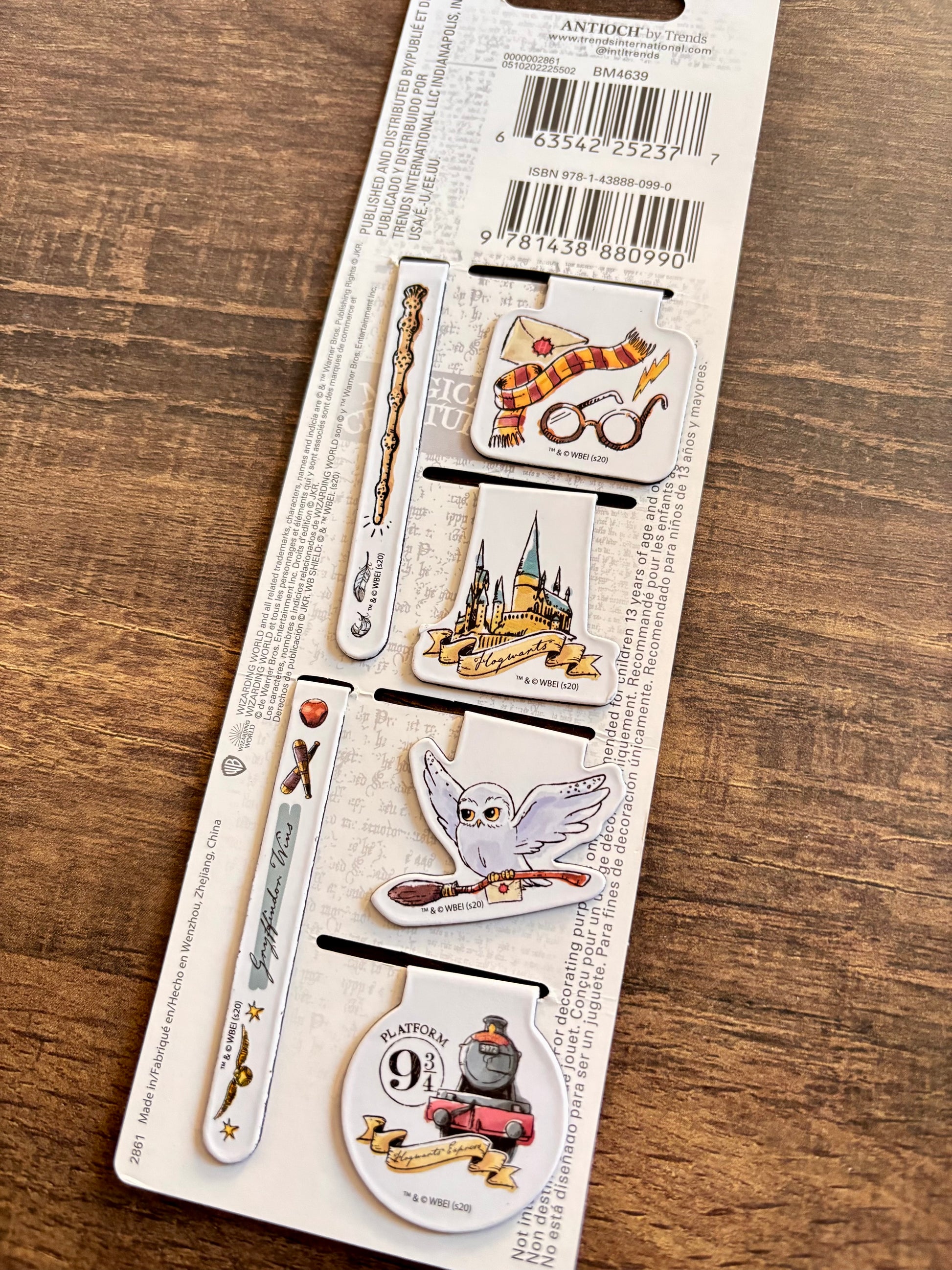 Packaged Harry Potter-themed stationery items on a wooden surface