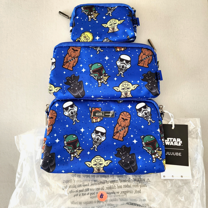 Set of blue cosmetic bags with Star Wars character patterns on a beige background