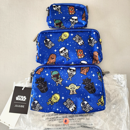 Three blue pouches with Star Wars character patterns on a beige background