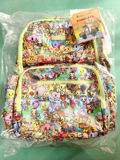 Colorful backpack with cartoon character pattern on a green background