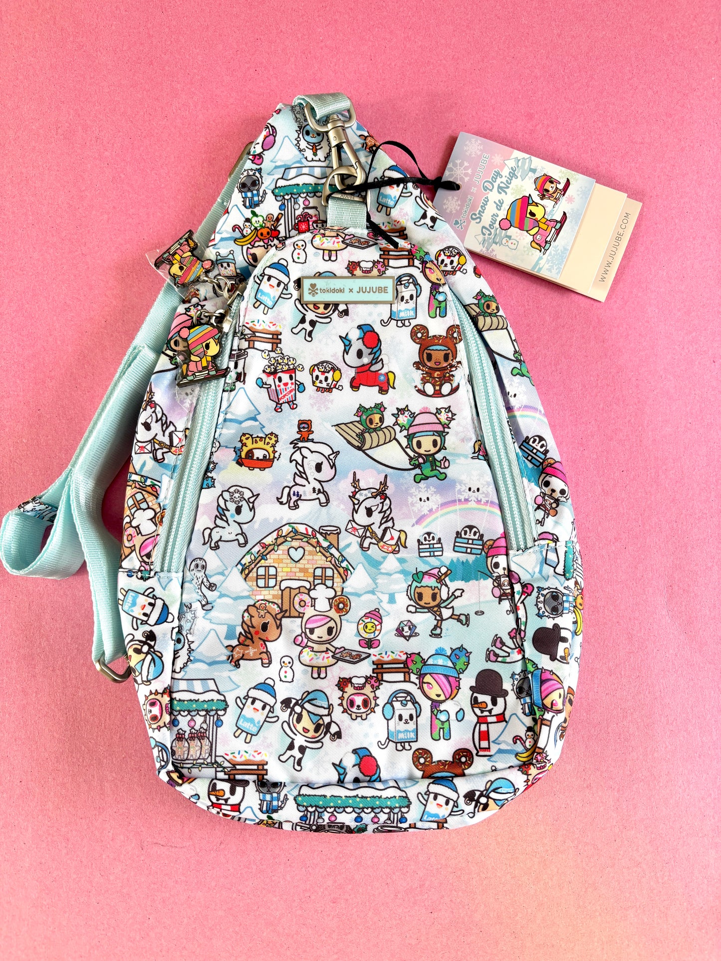 Patterned bag with cartoon characters on a pink background