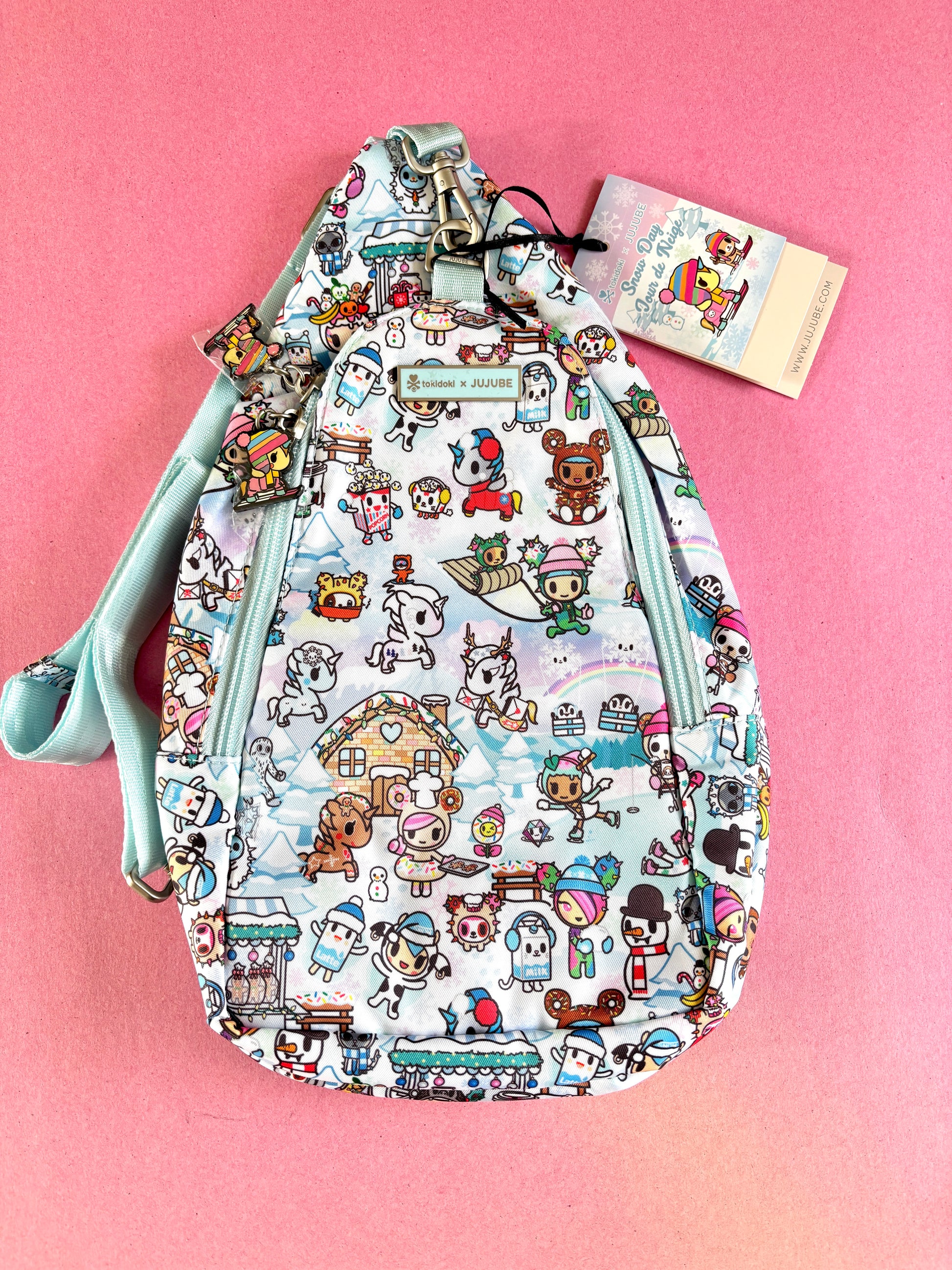 Patterned bag with cartoon characters on a pink background
