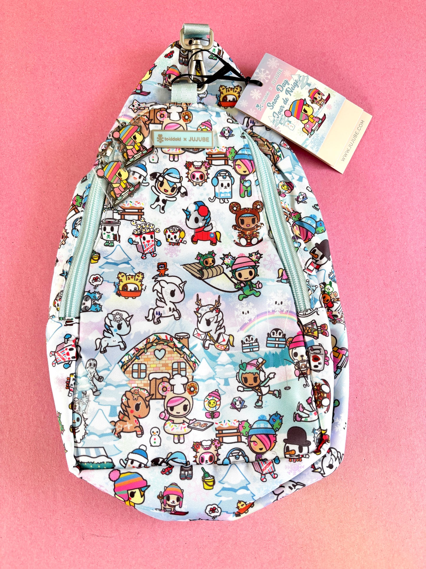Backpack with cartoon character pattern on a pink background