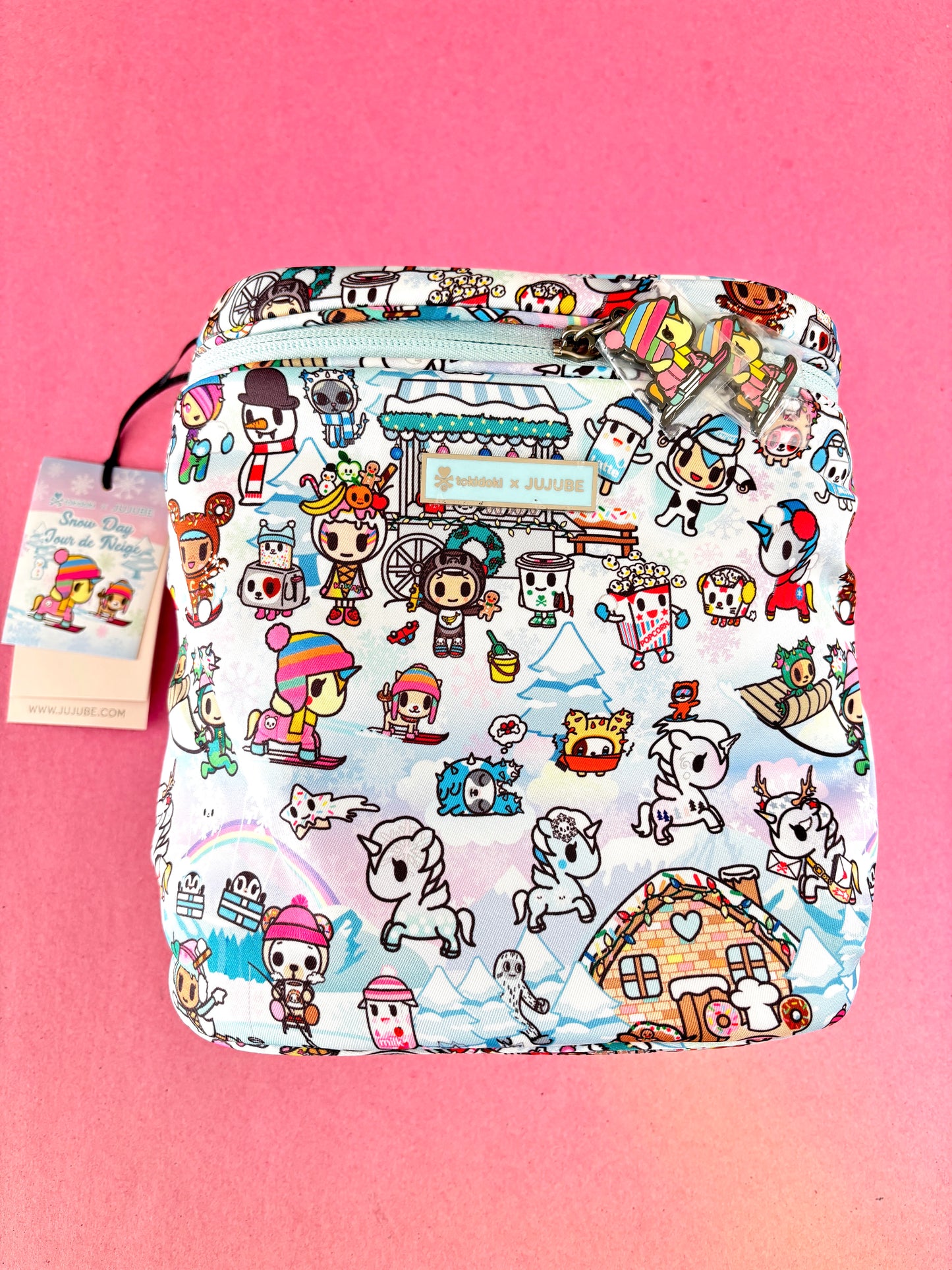 Pouch with cartoon character pattern on a pink background