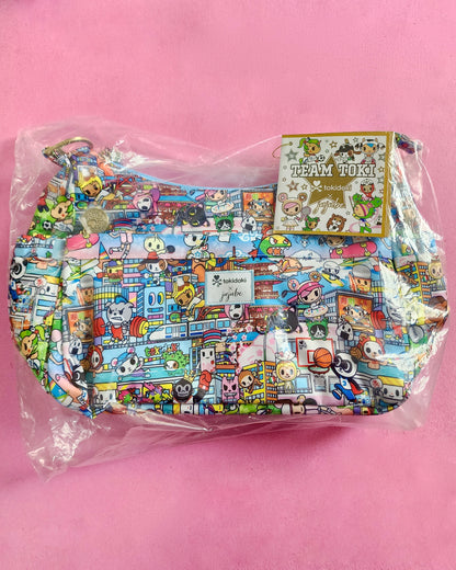 Colorful bag with cartoon character pattern on a pink background