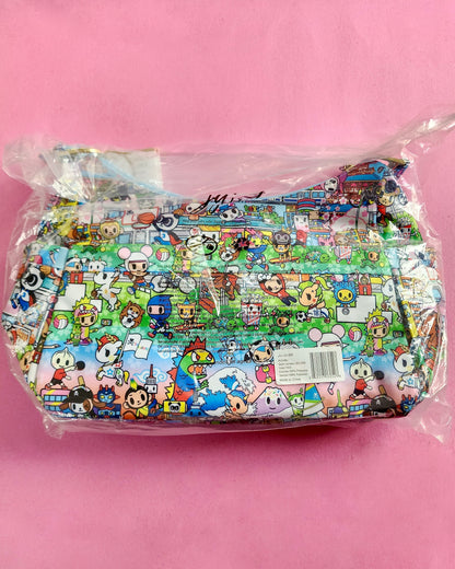 Cartoon character-themed product in clear packaging on a pink background