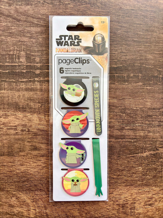 Packaging of Star Wars The Mandalorian themed page clips on a wooden surface