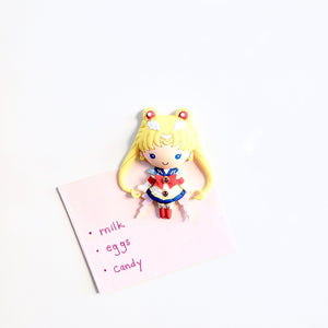 Shopping list hung on magnetic surface with Sailor Moon 3D vinyl figure magnet