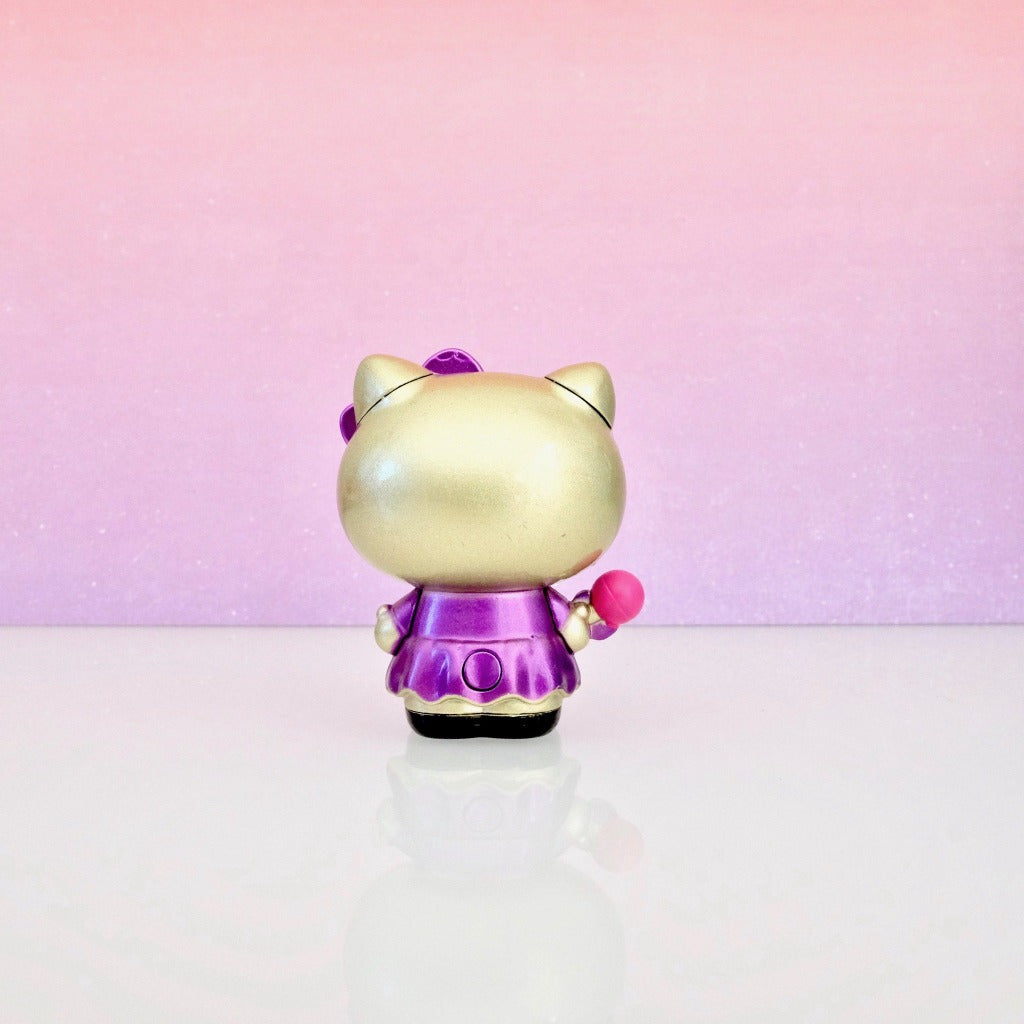 back view of unboxed Hello Kitty in purple dress with microphone Metalfigs