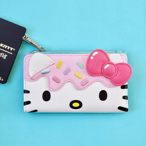Loungefly Hello Kitty Sweets Treat wallet front view on blue background