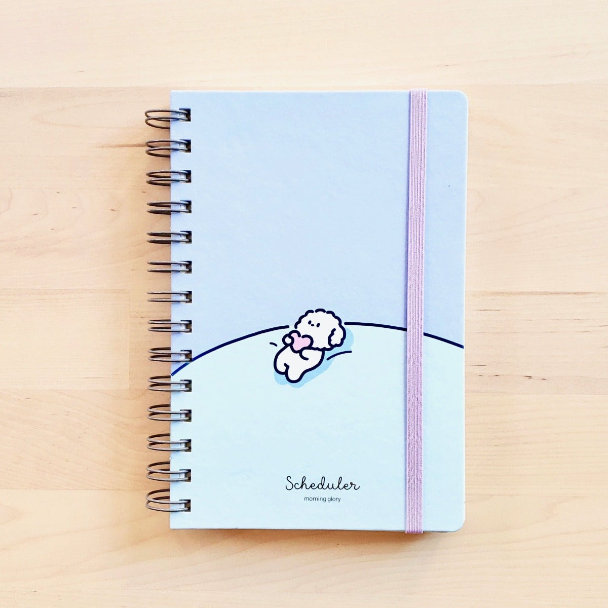 front cover morning glory light blue scheduler with doggy holding a heart