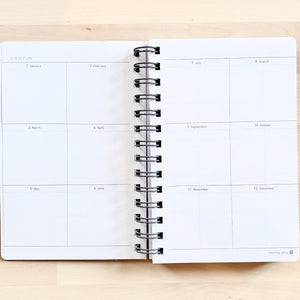 year planning pages of light pink morning glory scheduler