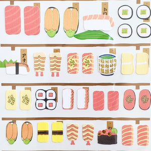 paper stickers of various sushi and japanese side dishes with gold accents