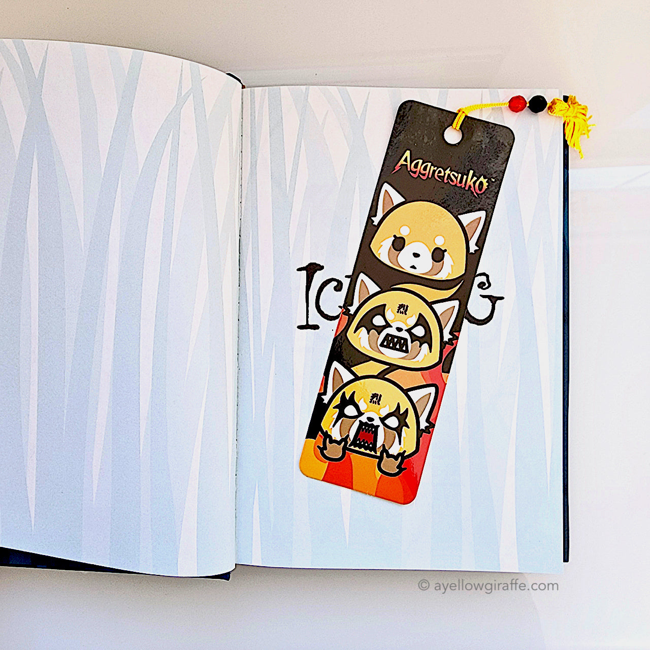 Aggrestuko bookmark inside book