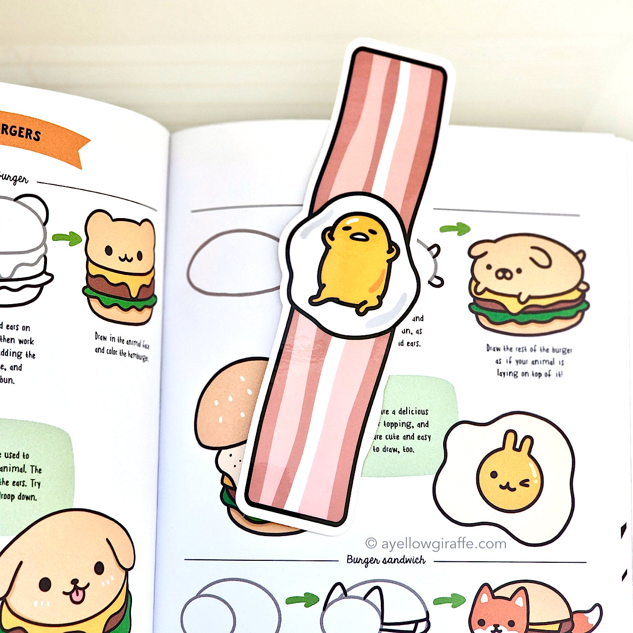 Gudetama fried egg on bacon strip bookmark inside book