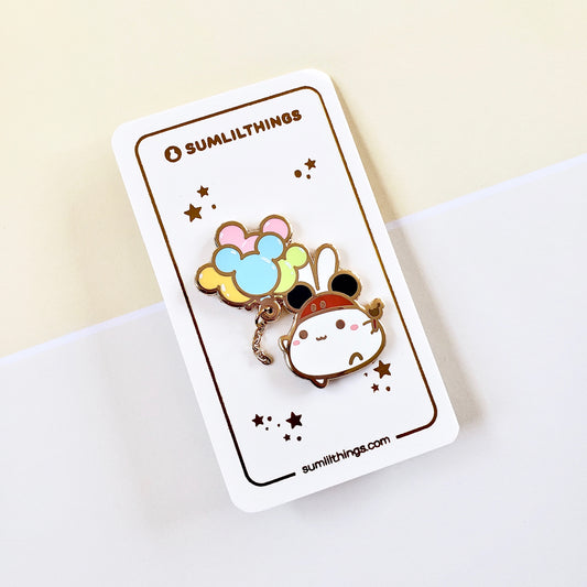 Cartoon character pin with balloons on a Sumlilthings branded card